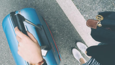 looking down at luggage and feet